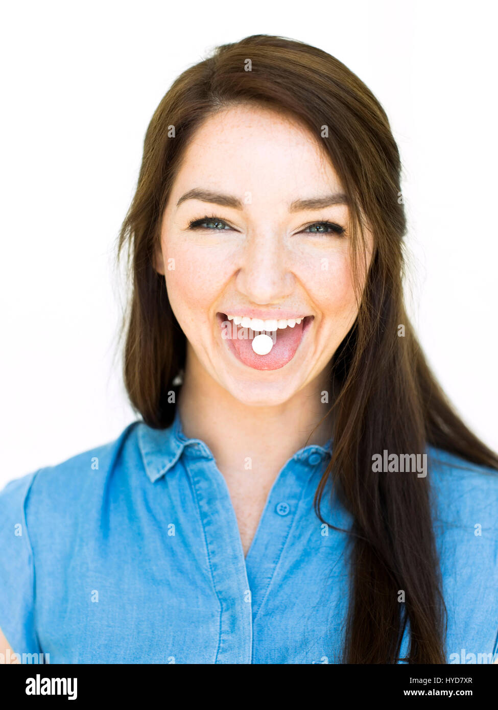 Woman sticking out long tongue hires stock photography and images Alamy