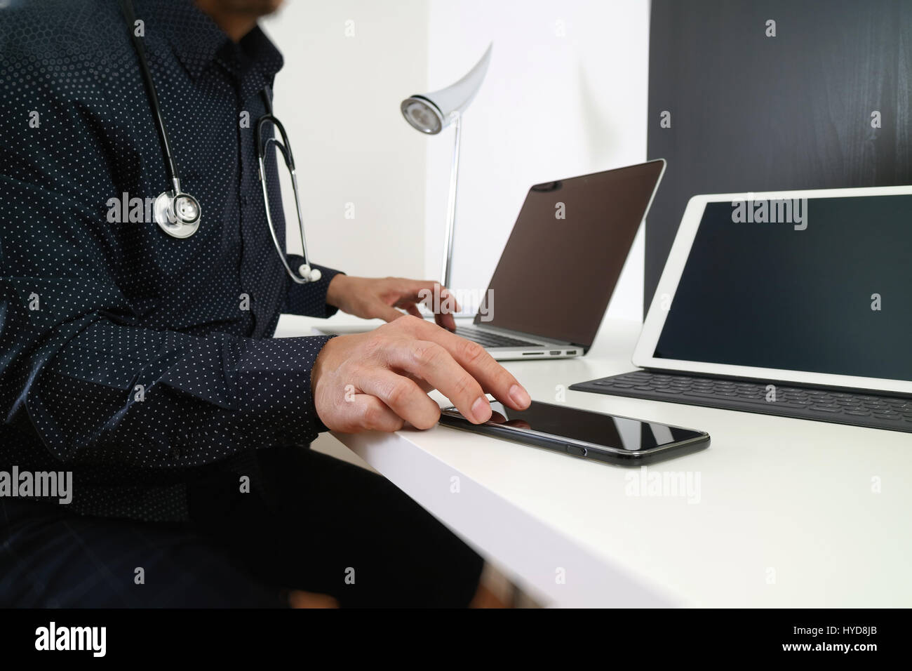 smart medical doctor working with smart phone and digital tablet and ...