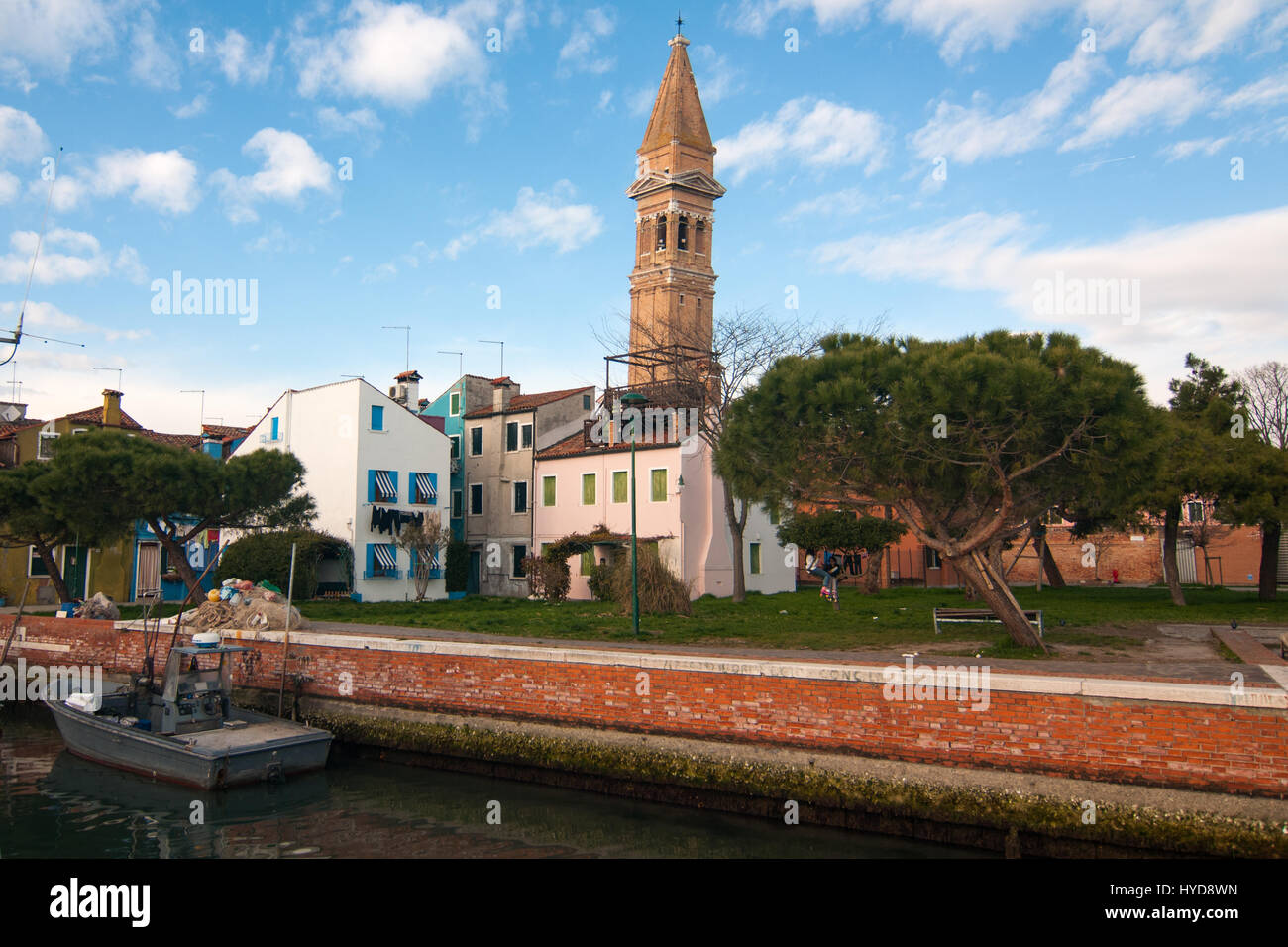 Houses, a canal and the tower bell of the island of Burano, Venice, Italy. Stock Photo