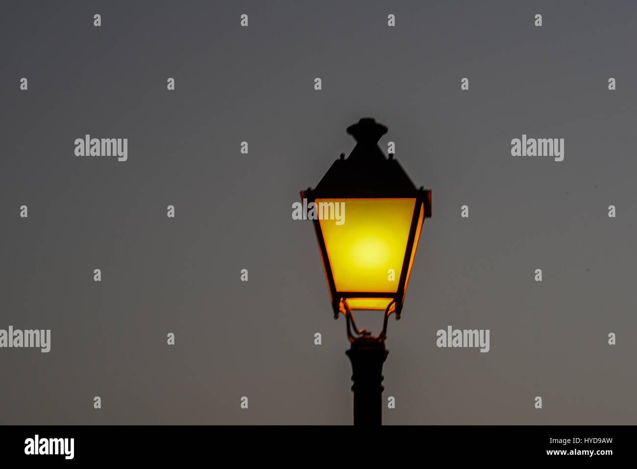 Ordinary street light on during the night in Spanish streets Stock Photo Alamy