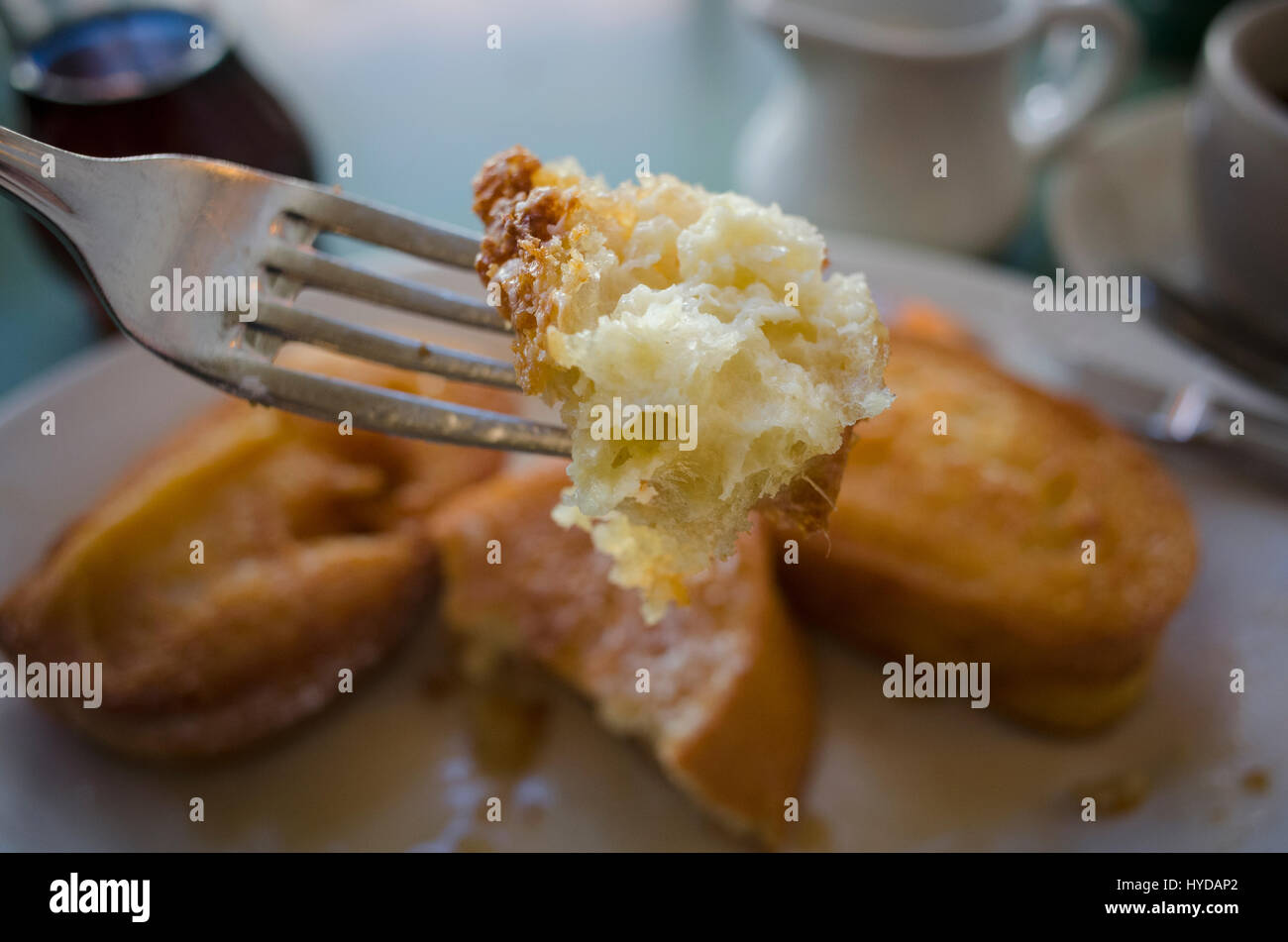 Piece of french toast on fork Stock Photo Alamy