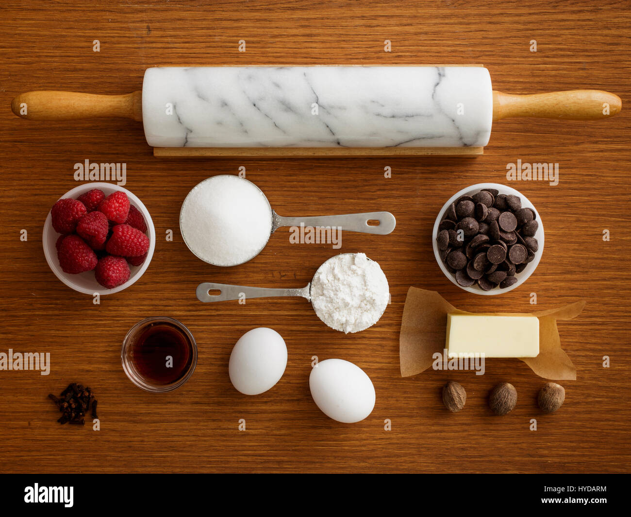 Studio shot of wooden table with rolling pin and fresh ingredients Stock Photo