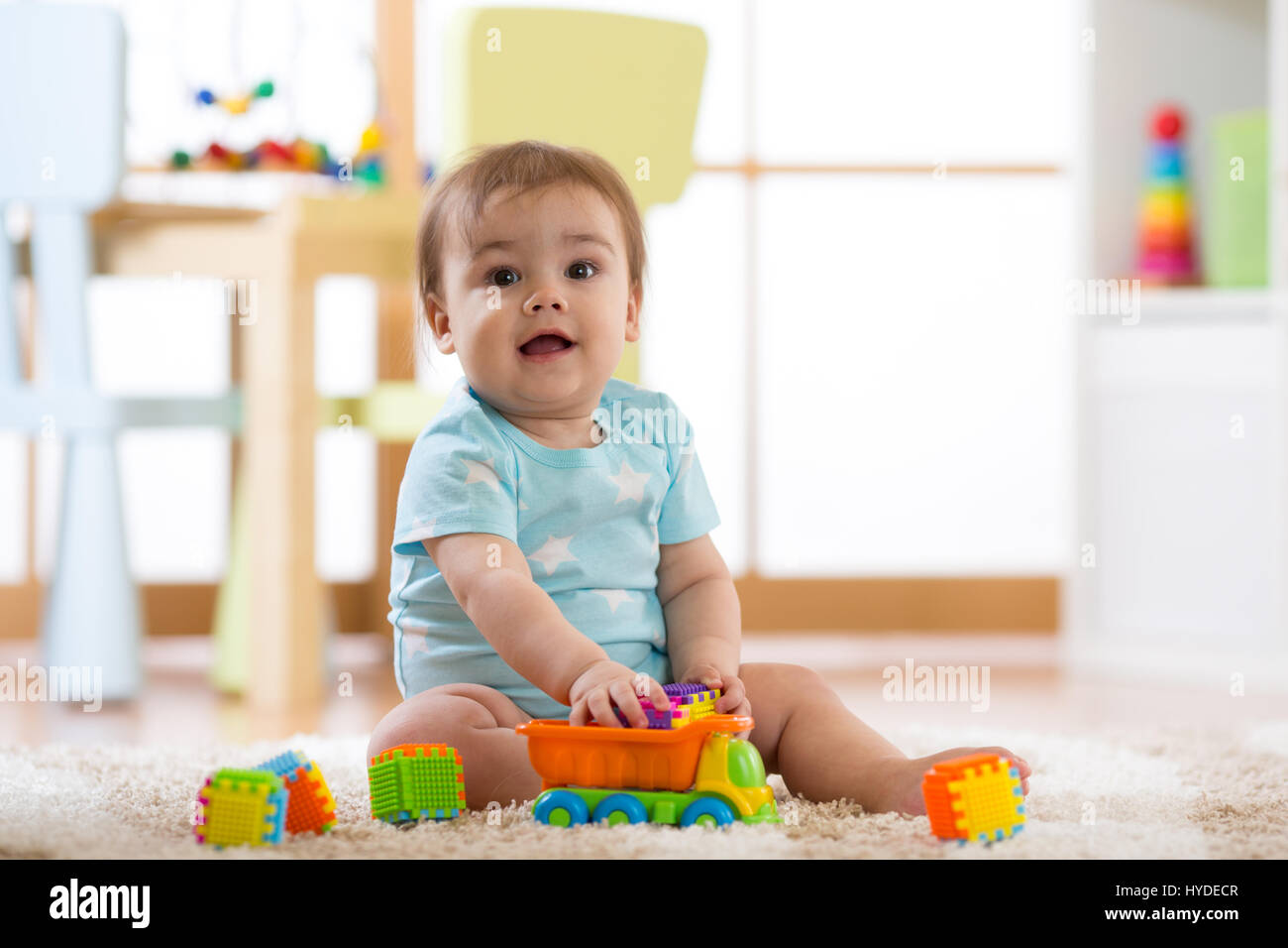 baby playing wooden toys at home or kindergarten Stock Photo Alamy