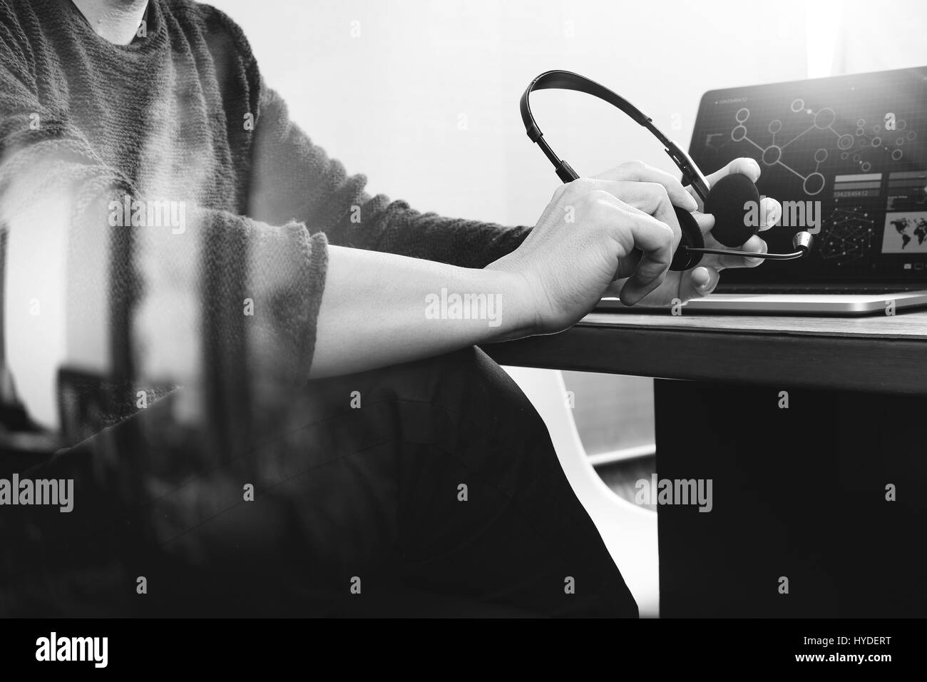 Man using VOIP headset with digital tablet computer docking smart keyboard, concept communication, it support, call center and customer service help d Stock Photo