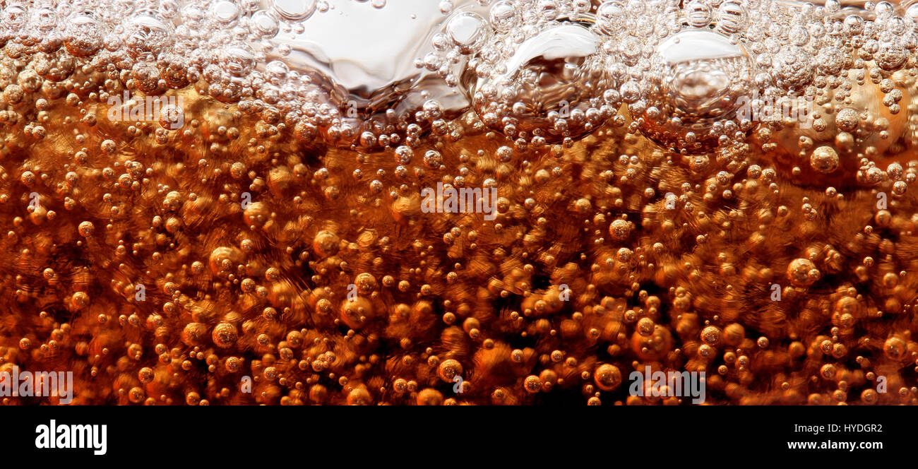 Macro shot of coca-cola bubbles with ice cubes Stock Photo - Alamy