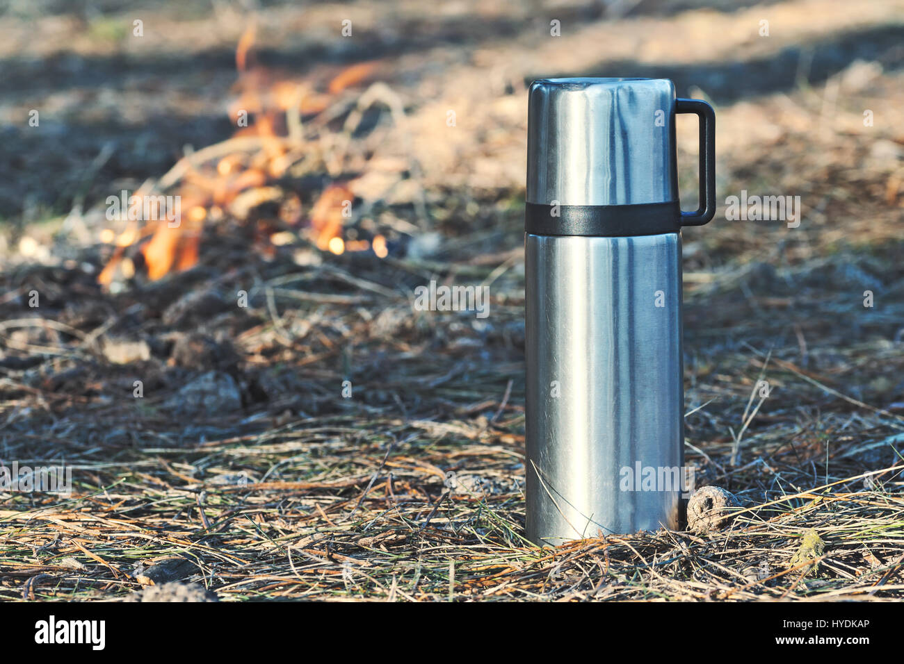 Caffe mug and heat sealing thermos cover made of stainless steel on thee  rock by taking photo during trekking in wild nature in forest Stock Photo -  Alamy