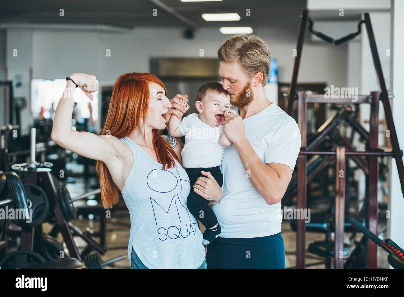Young family with little boy in the gym Stock Photo - Alamy