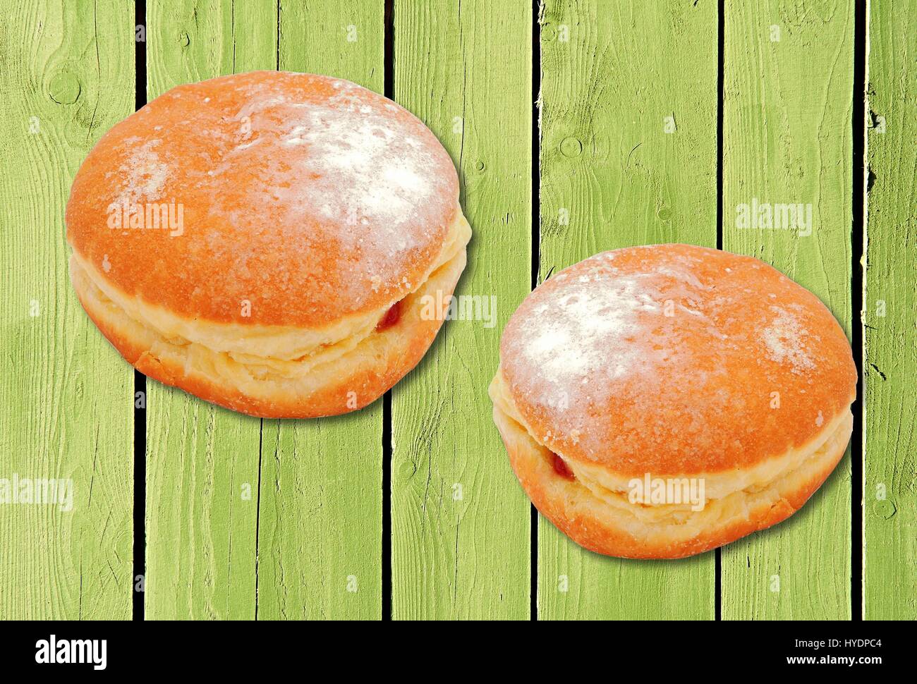 Two donuts with strawberry jam filling Stock Photo Alamy
