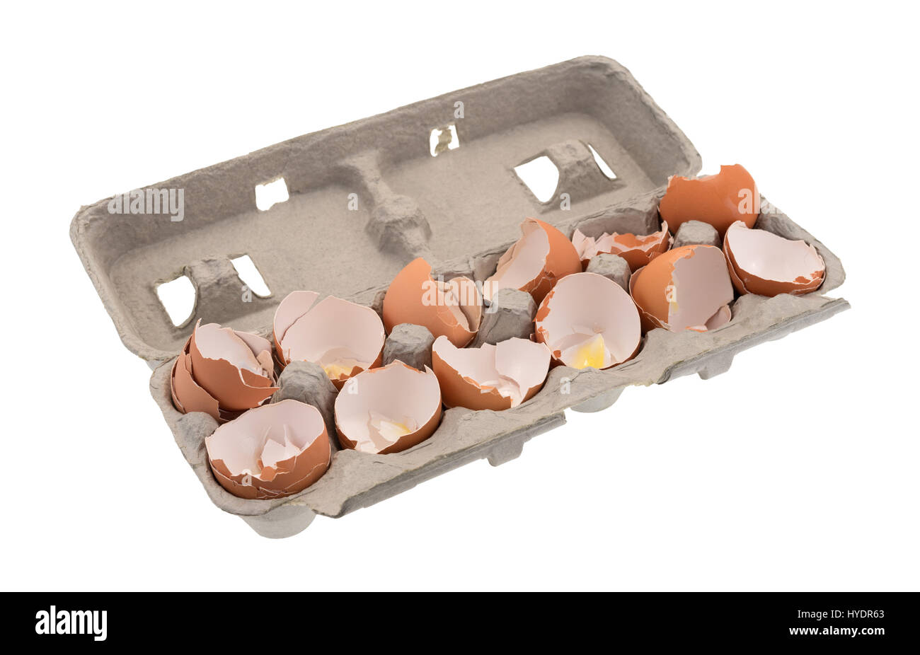 A dozen used egg shells in a cardboard container isolated on a white background. Stock Photo