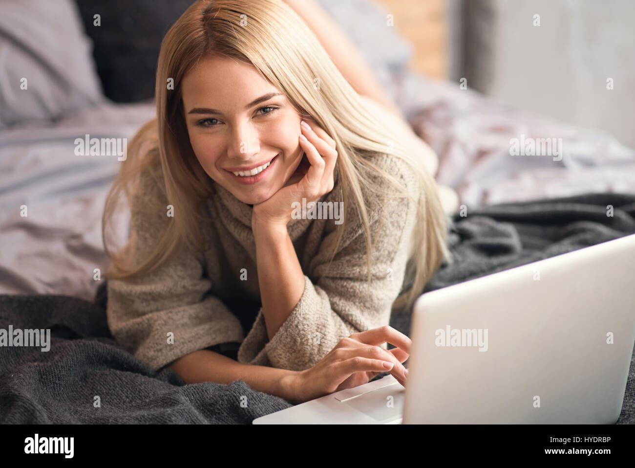 Cheerful girl enjoying freelance work at home Stock Photo