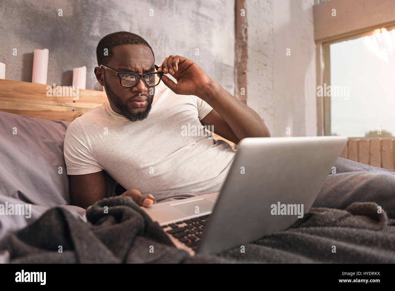 Capable young African American man working at home Stock Photo