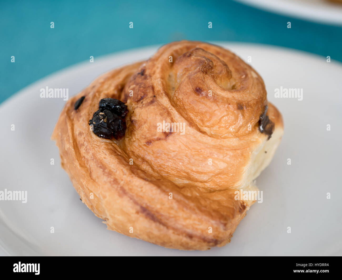 Fresh Rasin Croissant on a white bowl Stock Photo