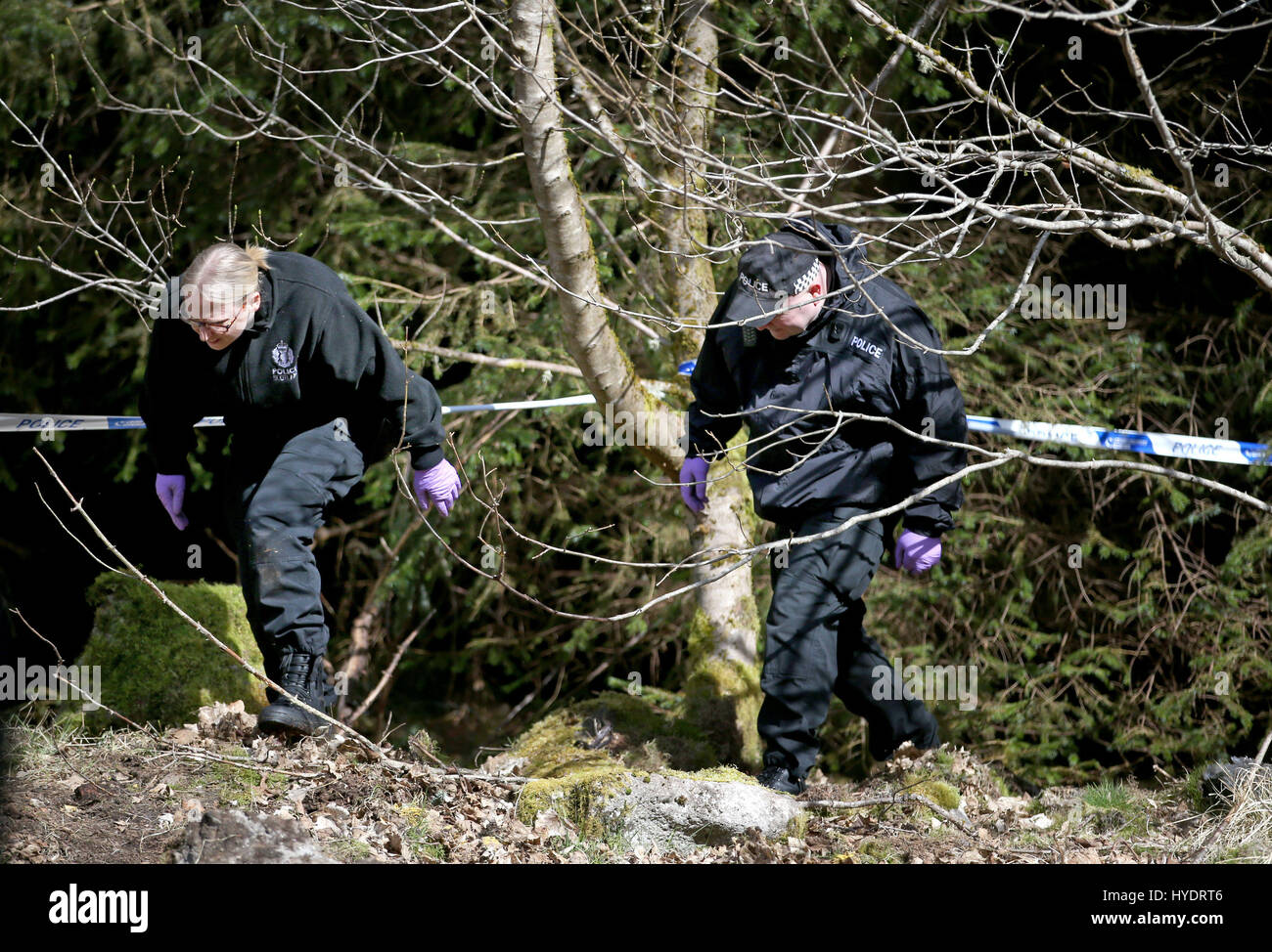 Police search woodland near Roberton in South Lanarkshire after Police Scotland appealed for new information in relation to the disappearance of Emma Caldwell who was found dead in woods near Biggar, South Lanarkshire, in May 2005. Stock Photo