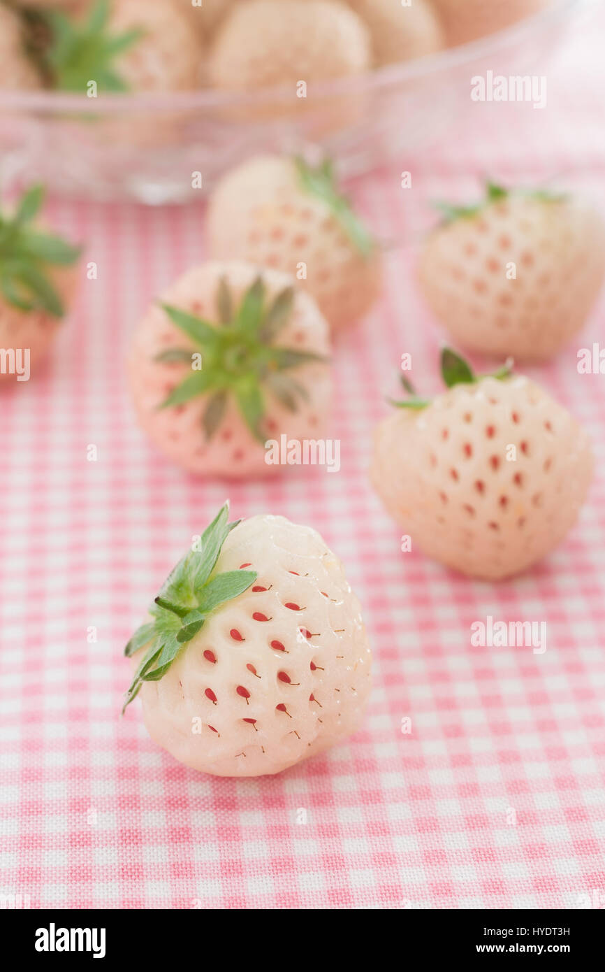 Pineberries or Hula Berry a hybrid strawberry with a pineapple flavor white flesh and red seeds Stock Photo