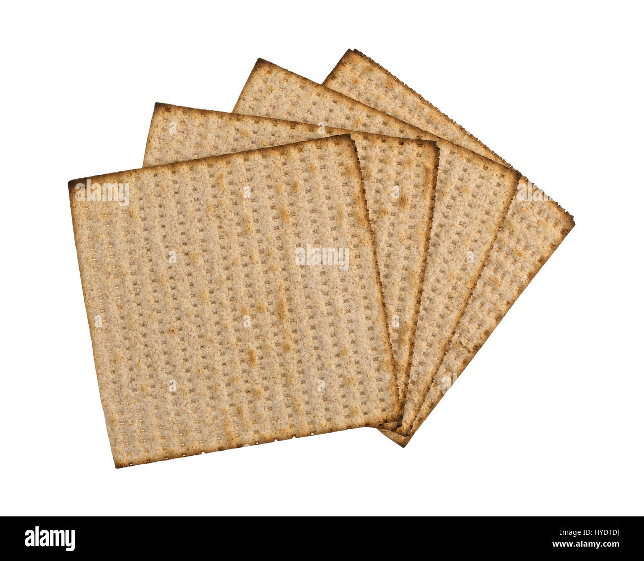Top view of a several whole wheat matzo crackers fanned out isolated on