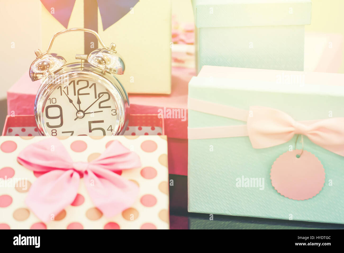 Alarm clock and gift box with copy space. Vintage or Retro tone