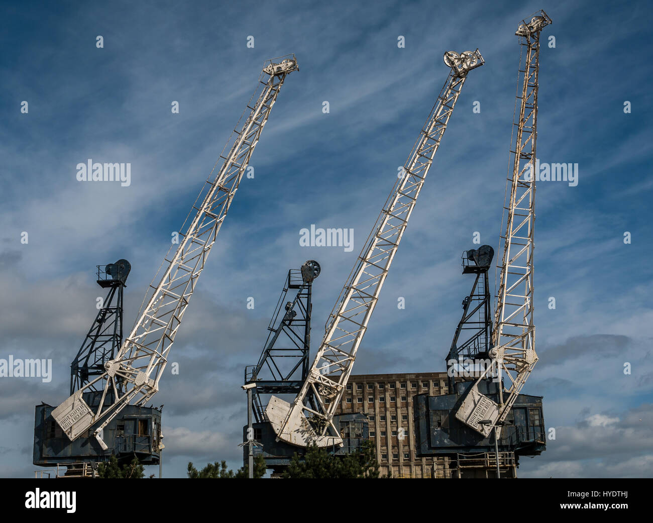 Disused Stothert and Pitt dockside cranes, Leith Docks, Leith, Edinburgh, Scotland, UK, against a blue sky Stock Photo