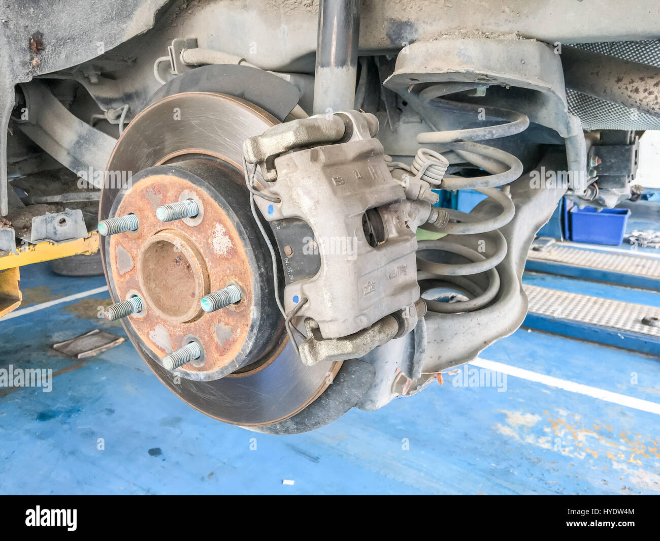 Car repair change brake tire in garage Stock Photo Alamy