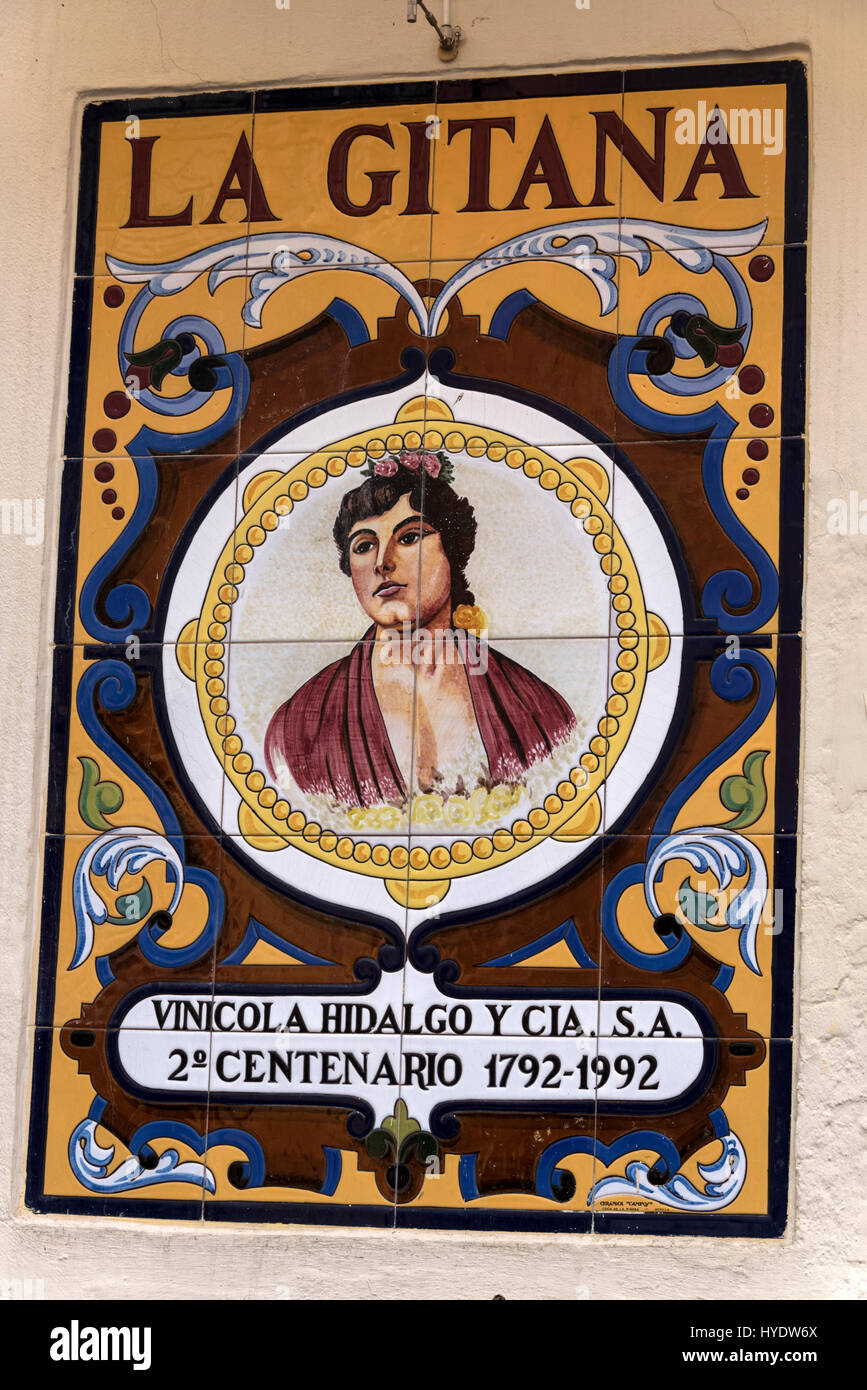 Picture ceramic tile images of Spanish scenes on the exterior walls of some of the restaurants.in Seville Old Town, Seville, Spain. Stock Photo