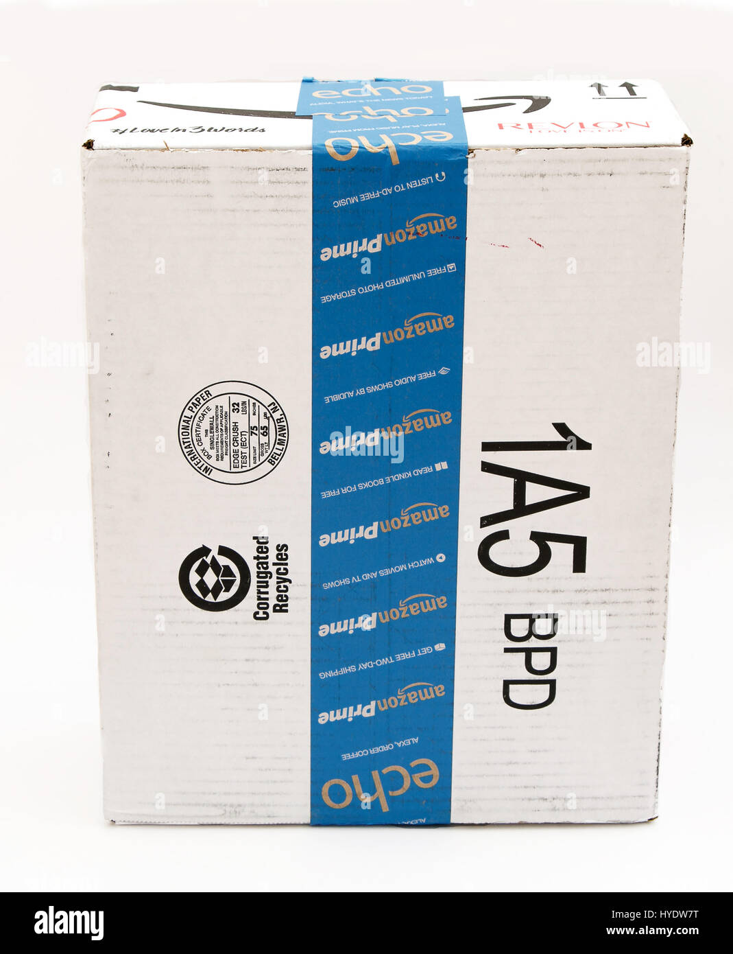 An Amazon shipping cardboard box isolated on white background. Stock Photo
