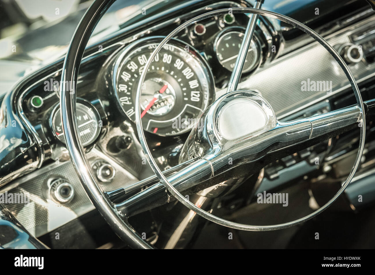 retro styled classic car steering wheel and dashboard dials Stock Photo