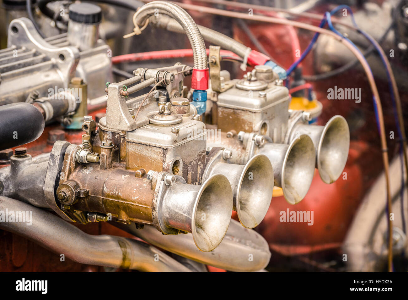 old carburetor closeup on a rusty classic sportscar engine Stock Photo