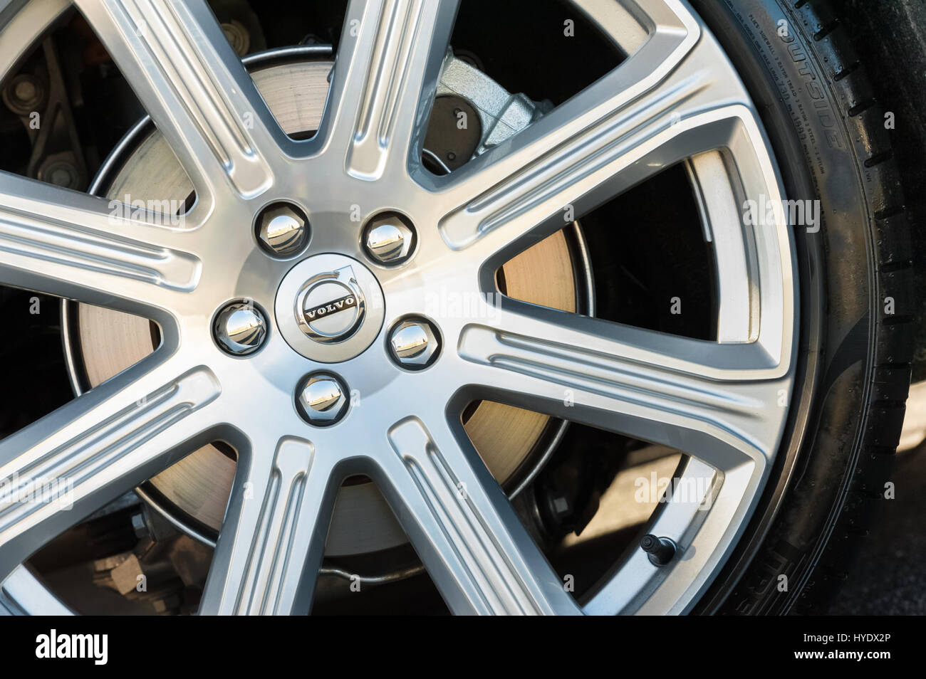Laverstoke, UK - August 25, 2016: Closeup of chromed wheel and brake disc assembly on a vehicle manufactured by Swedish company Volvo Stock Photo