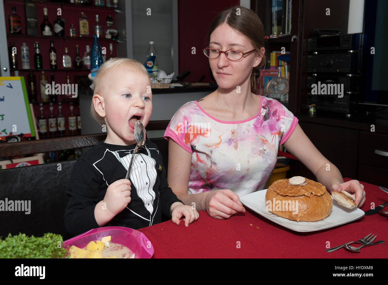 Two year old boy eating soup Stock Photo Alamy
