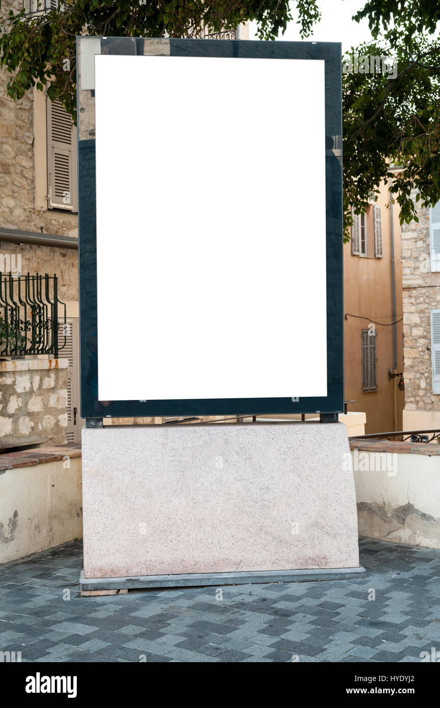 Empty vertical billboard in a place under a tree Stock Photo