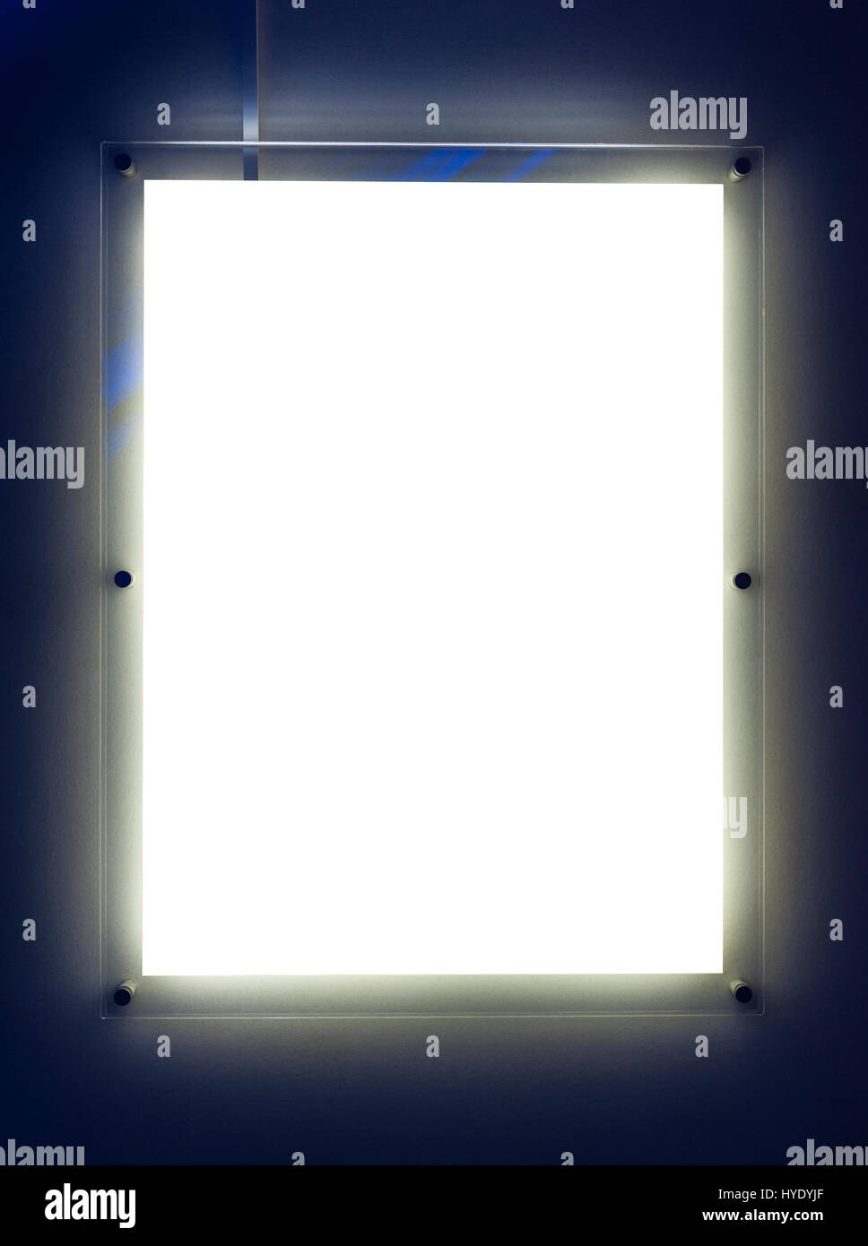 Empty illuminated billboard for your ad isolated on blue Stock Photo