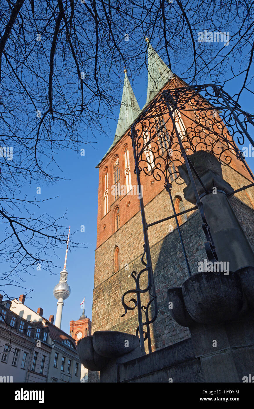 Berlin - The Nikolaikirche church and the Fernsehturm in the backgroud in evening light. Stock Photo