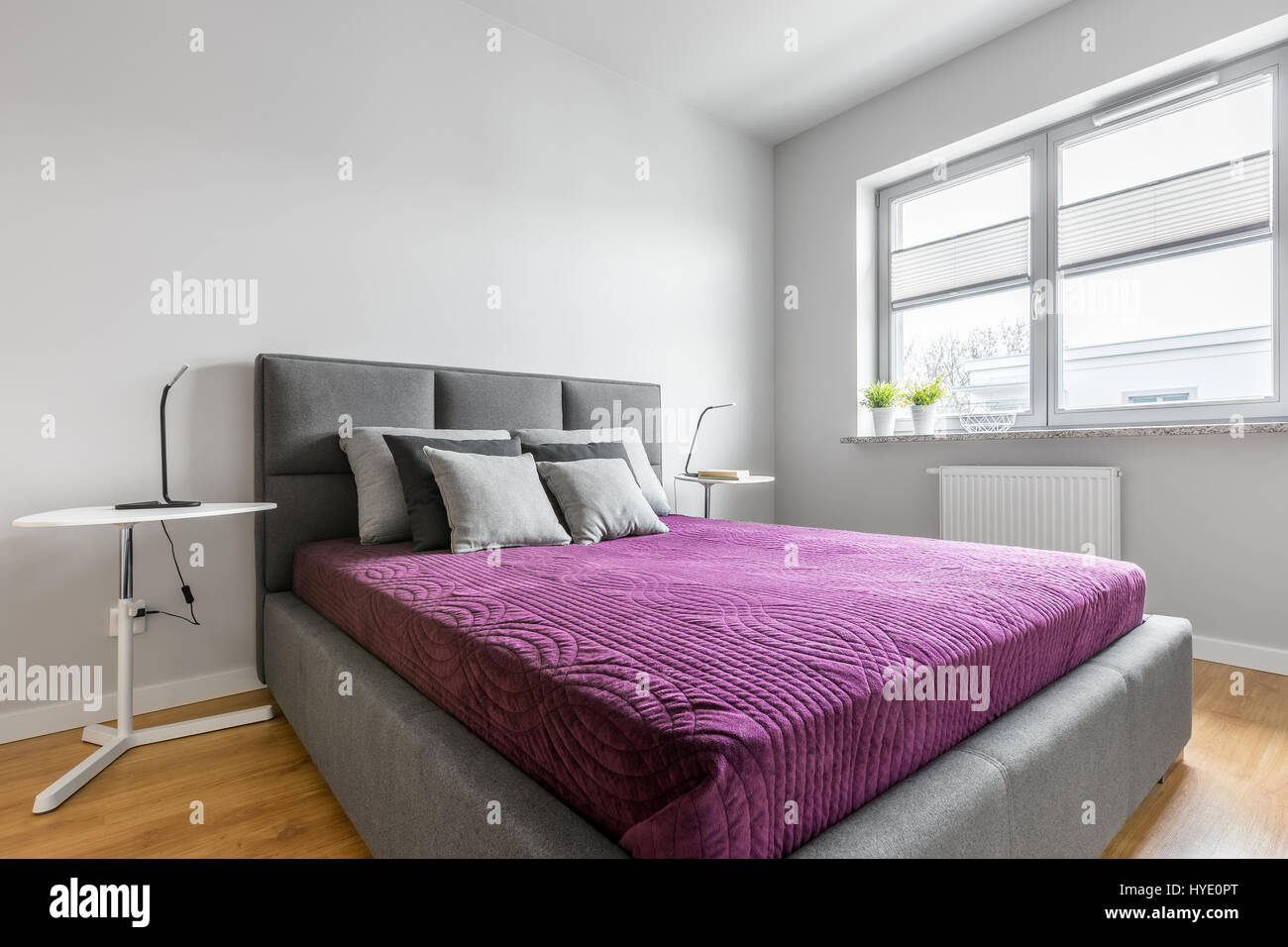 Simple White Bedroom With Grey Upholstered Bed Two