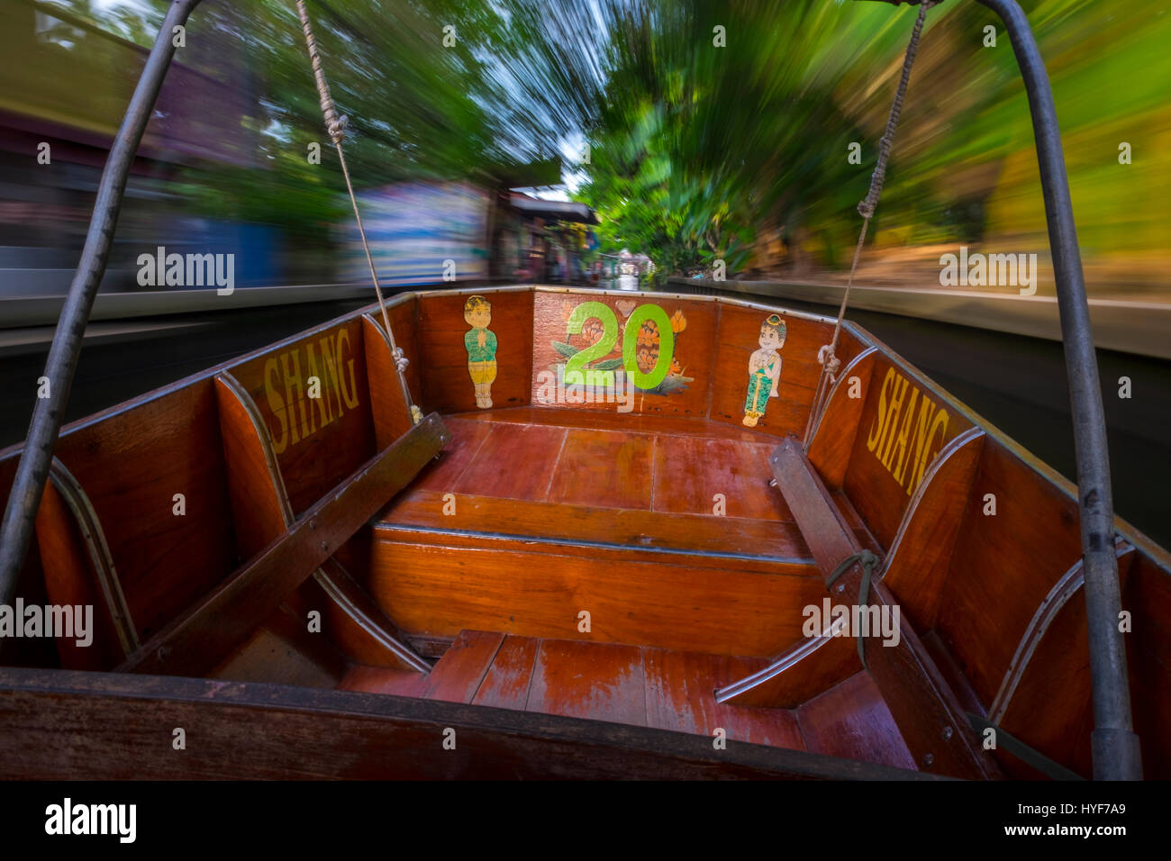 DAMNOEN SADUAK, THAILAND - CIRCA SEPTEMBER 2014: Motorboat navigating a canal close the famous floating market of Damnoen Saduak in the central region Stock Photo