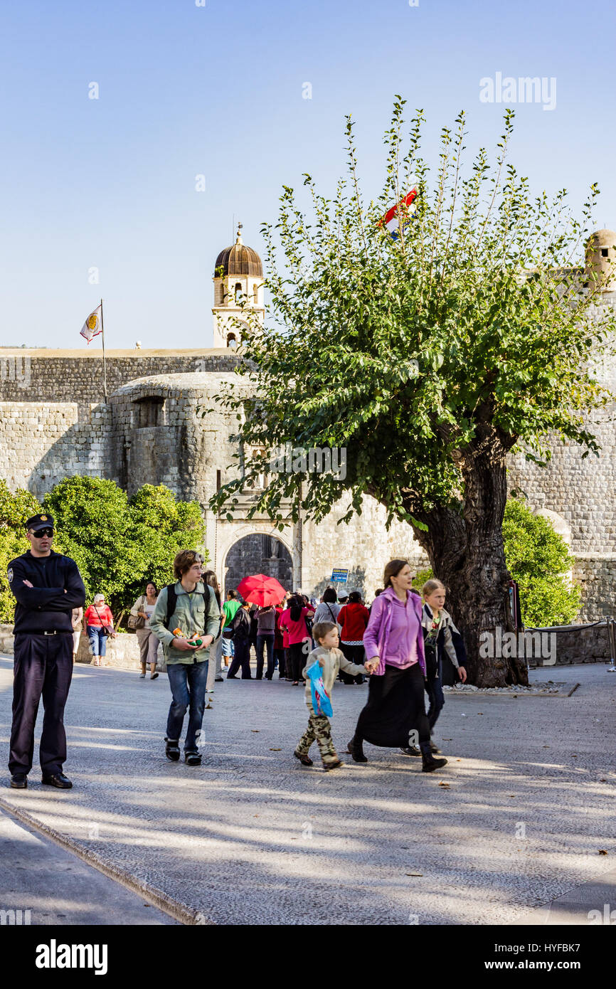 Tourists visiting the wall city in Dubrovnik Stock Photo