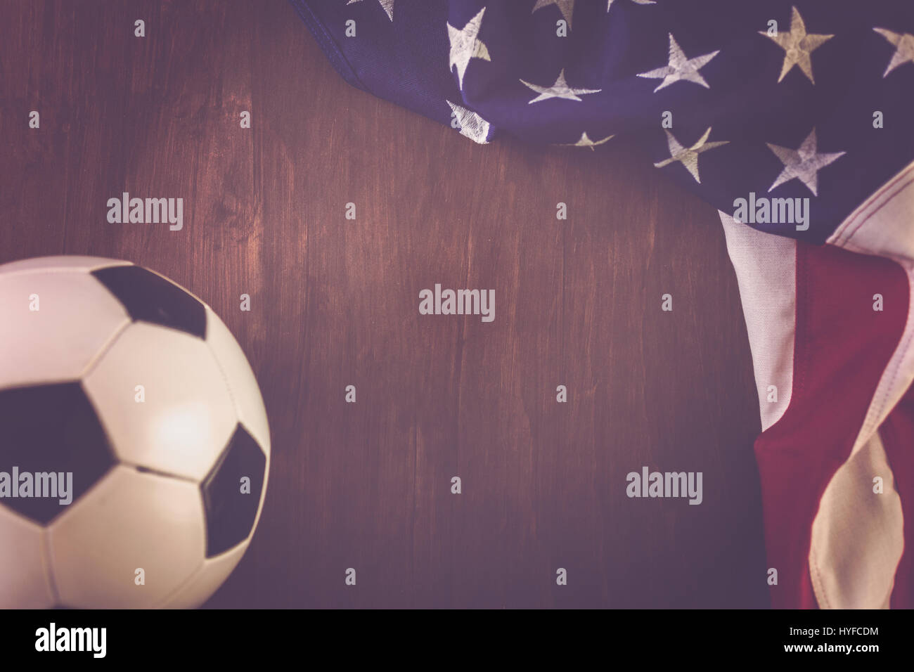 Soccer ball and American Flag on a wood background Stock Photo - Alamy