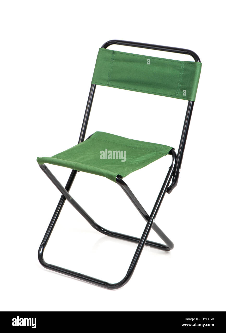 Folding chair with green fabric isolated on white background Stock