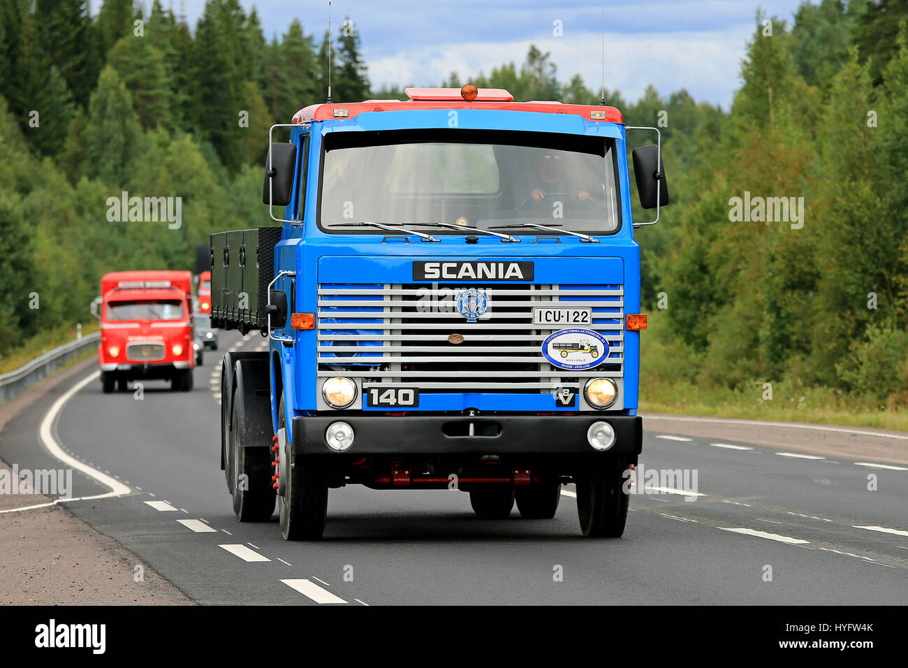 JALASJARVI, FINLAND - AUGUST 14, 2017: Blue Scania 140 V8 tipper truck on the road with another classic Scania on the background. The 140 was manufact Stock Photo