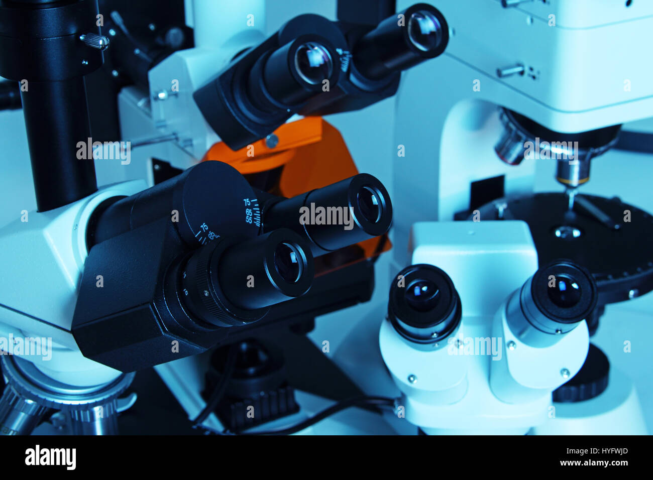 Group of various Microscopes in blue medicine light Stock Photo Alamy