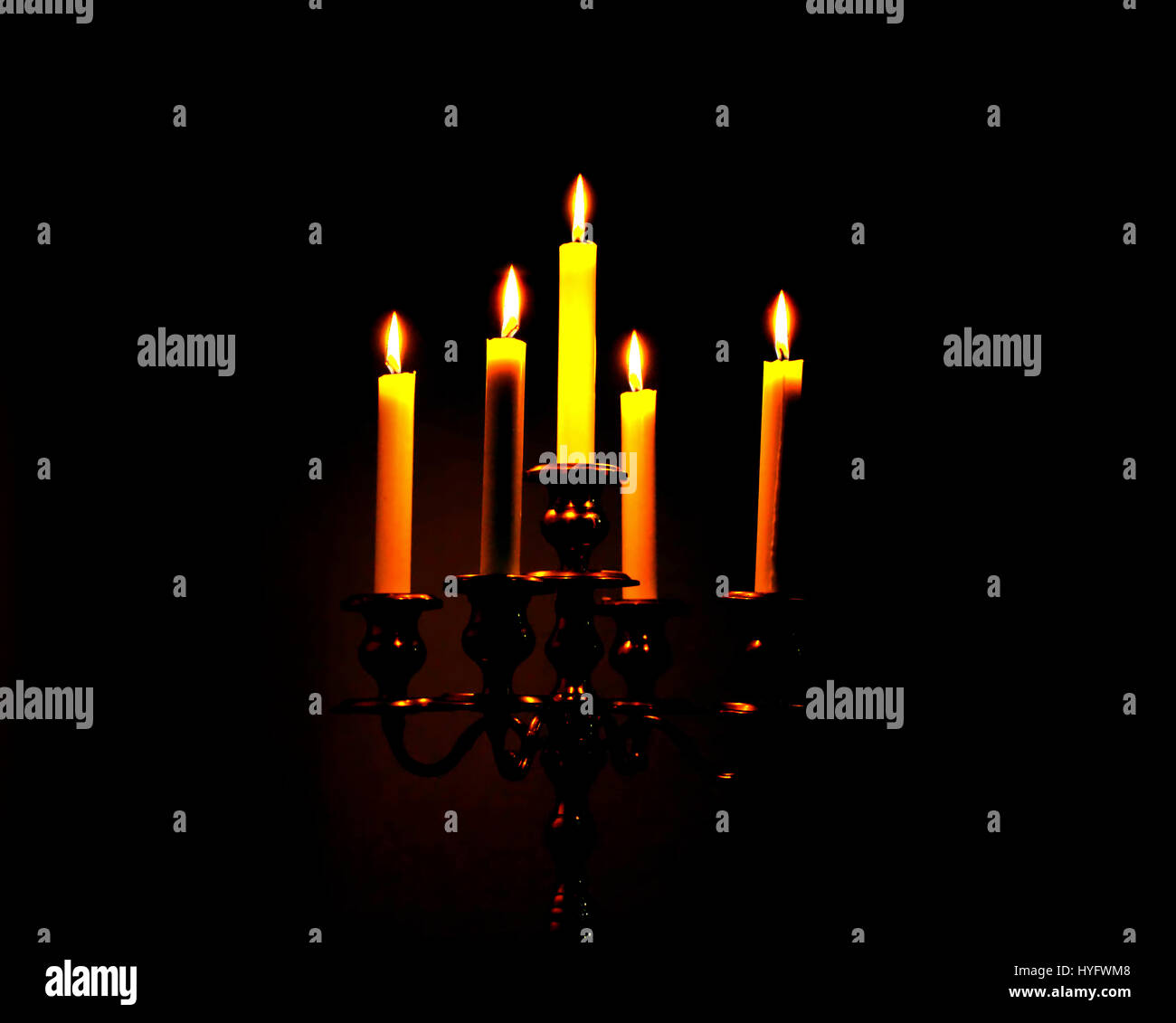 Burning candles on dark background Stock Photo - Alamy