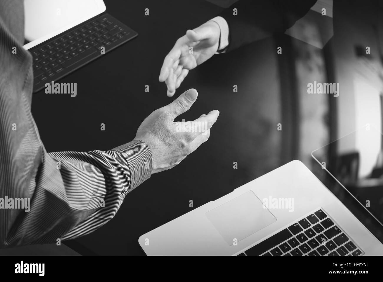 Business partnership meeting concept.photo businessmans handshake. Successful businessmen handshaking after perfect deal,black and white Stock Photo