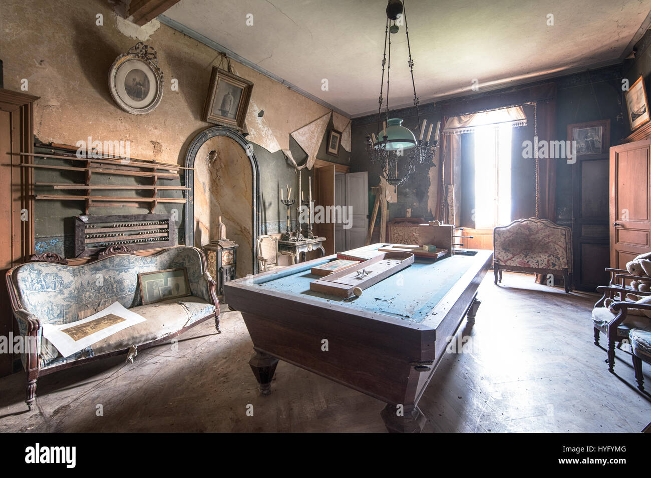 HAUNTING images reveal the extraordinary taxidermy and gun collection left to rot in the ruins of a derelict French castle that could have been abandoned for the past six decades. Eye-opening photographs display the spooky animal ornaments spread all over the large abandoned mansion as-well-as the rifles and ammunition that could have been used on safari to hunt them down. Captured by urban explorer Florian Michaud, 30, these photographs include stuffed turtles, crocodiles, a shark, a cobra and mongoose battling each other, a duck, fish, rabbit, antelope, peacock and a stag’s head. From the ag Stock Photo