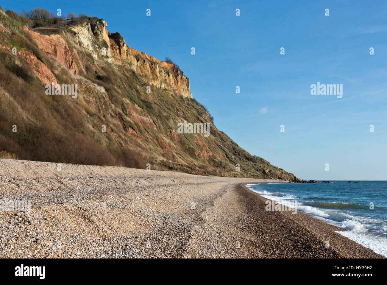The view along Devons Jurassic Coast from the beach at Weston Mouth towards Higher Dunscombe Cliff,  part of the East Devon AONB Stock Photo