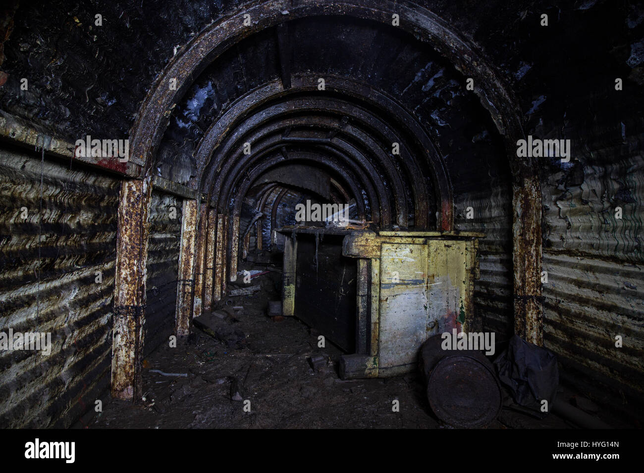 PORT GLASGOW, SCOTLAND: TAKE a look inside the largest purpose built civilian WW2 shelter in the UK where up to one thousand people could have sought refuge from Nazi attacks. Eerie pictures show the dark, rusted tunnels of the underground shelter which was built into the side of a cliff in Port Glasgow, Scotland. Other images show what remains of the toilets and the generator that would have been used to power the shelter. The shots were taken by urban exploration group Abandoned Scotland who hope to draw attention to some of Scotland’s forgotten landmarks. Stock Photo