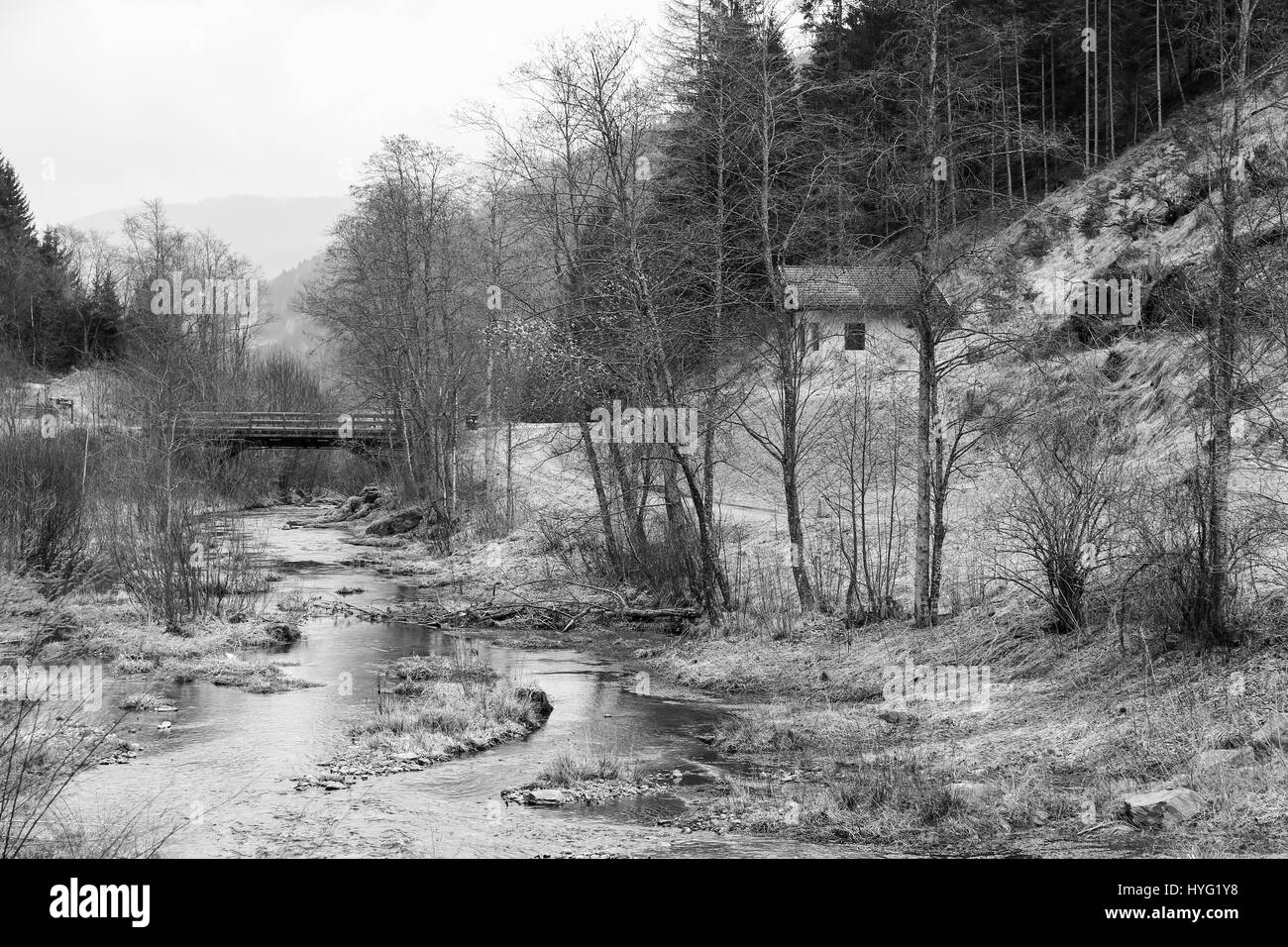 Sankt Walburg, Italy - March 22, 2017: The river Falschauer in the Ulten Valley in South Tyrol. The picture is monochrome. Stock Photo