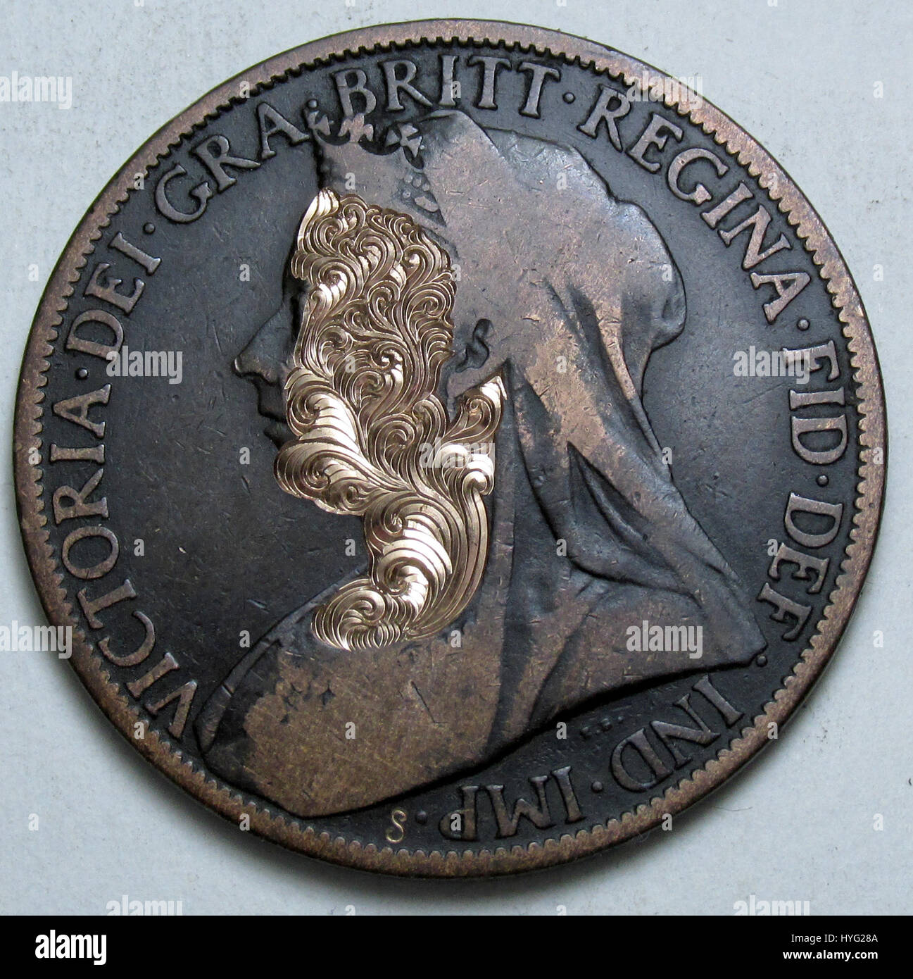 STUNNING pictures and video have revealed miniature works of art that have been hand engraved into coins. The incredible footage shows the painstaking process the hand engraver goes through to create a cool design on an 1896 Queen Victoria penny. Other amazing engravings include a portrait of the musician Prince on a US quarter, Abraham Lincoln sitting on a toilet on a US penny and Roman centurion carved onto a 1,000-year-old Constantine Roman coin. The labour of love engravings were carried out by hand engraver Shaun Hughes (53) from Essex who began recording his work to inspire others who wa Stock Photo