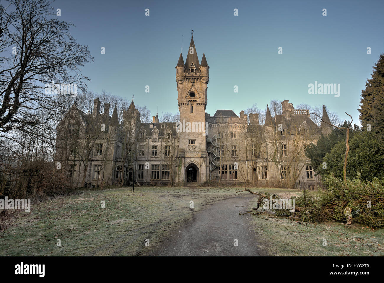 HOUYET, BELGIUM: STUNNING pictures show what could be the most perfect yet abandoned fairy-tale castle that was built by a pioneering English architect. The spectacular images show the outside of the castle, which still looks like something out of a Disney film, while inside the true damage is revealed. Piles of rubble are strewn throughout the building as staircases and walls have crumbled while the floors have been ripped out. Englishman Edward Milner was commissioned in 1866 by Liedekerke-Beaufort family to build Château Miranda in Belgium, more recently known as Château de Noisy. Milner wa Stock Photo