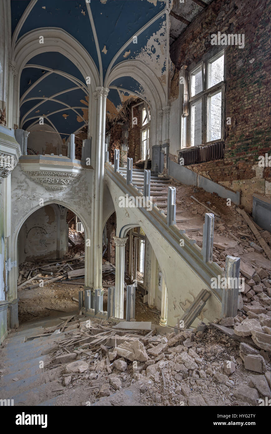HOUYET, BELGIUM: STUNNING pictures show what could be the most perfect yet abandoned fairy-tale castle that was built by a pioneering English architect. The spectacular images show the outside of the castle, which still looks like something out of a Disney film, while inside the true damage is revealed. Piles of rubble are strewn throughout the building as staircases and walls have crumbled while the floors have been ripped out. Englishman Edward Milner was commissioned in 1866 by Liedekerke-Beaufort family to build Château Miranda in Belgium, more recently known as Château de Noisy. Milner wa Stock Photo