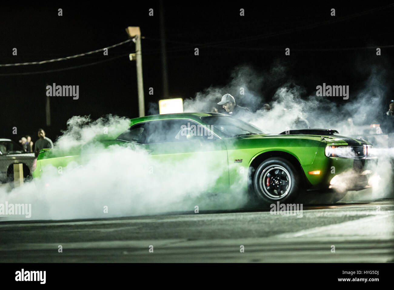 Challenger does a smoky burnout Stock Photo