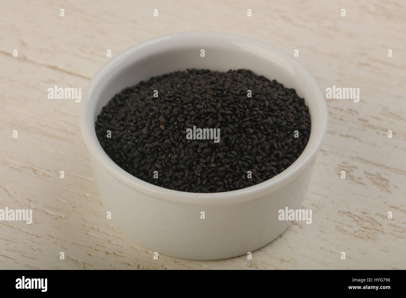 Black sesam seeds over wood background Stock Photo Alamy