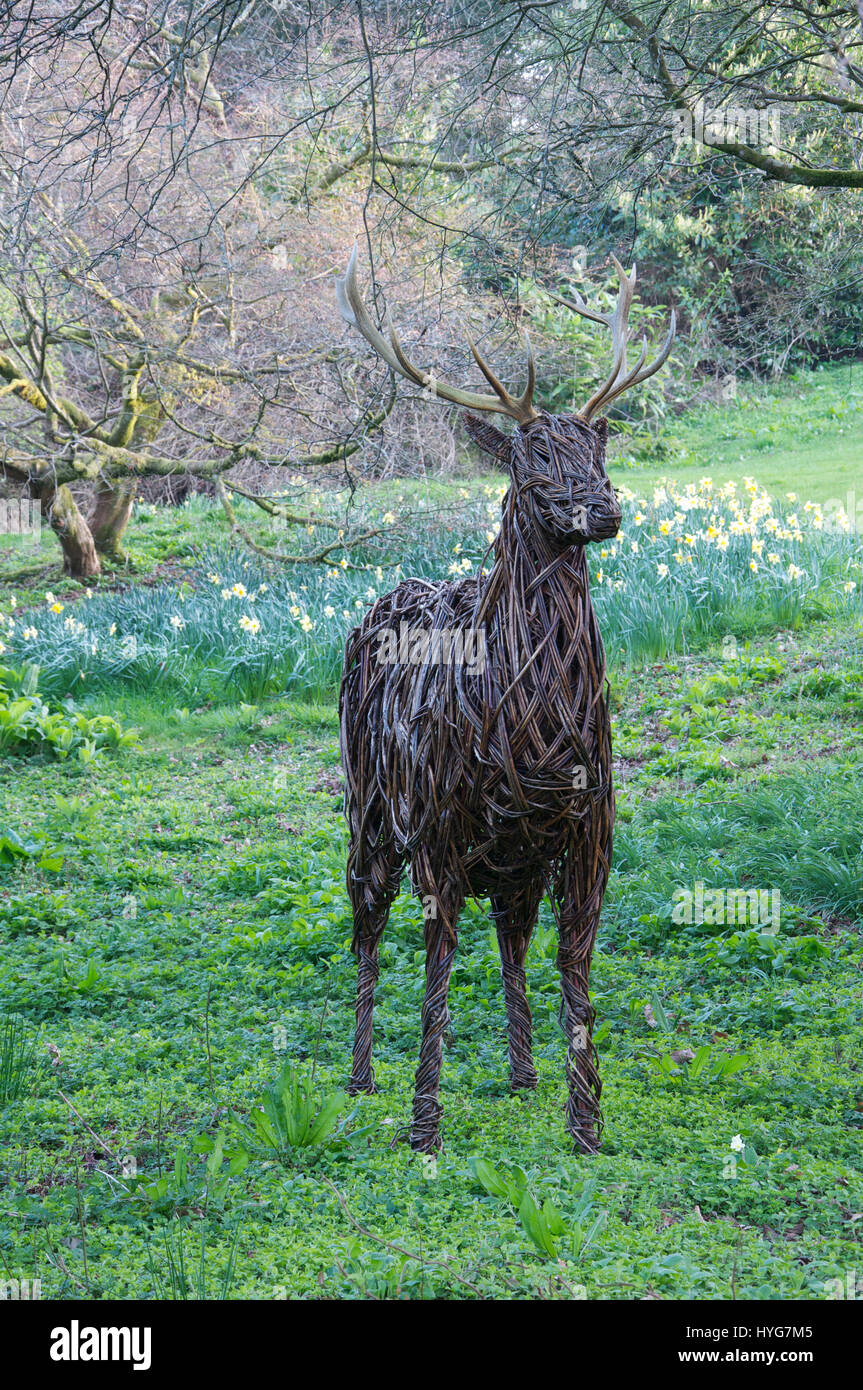 Rural handicrafts. A life size figure of a stag woven out of long sticks of willow. Minterne Gardens. Dorset, England, United Kingdom. Stock Photo
